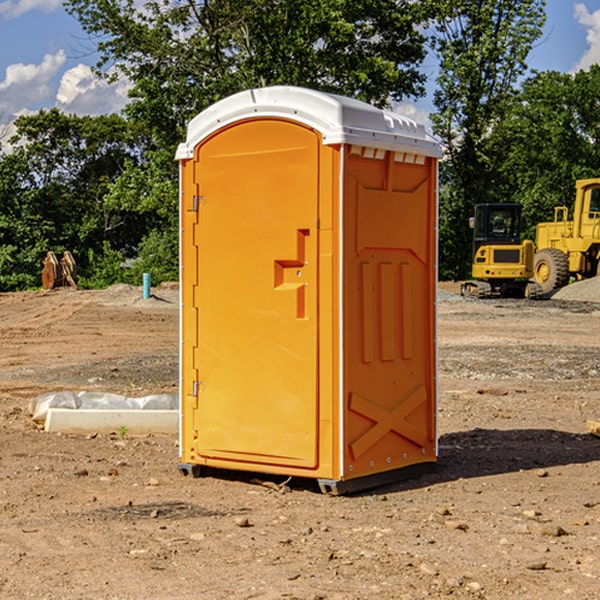 what is the cost difference between standard and deluxe portable toilet rentals in Alden